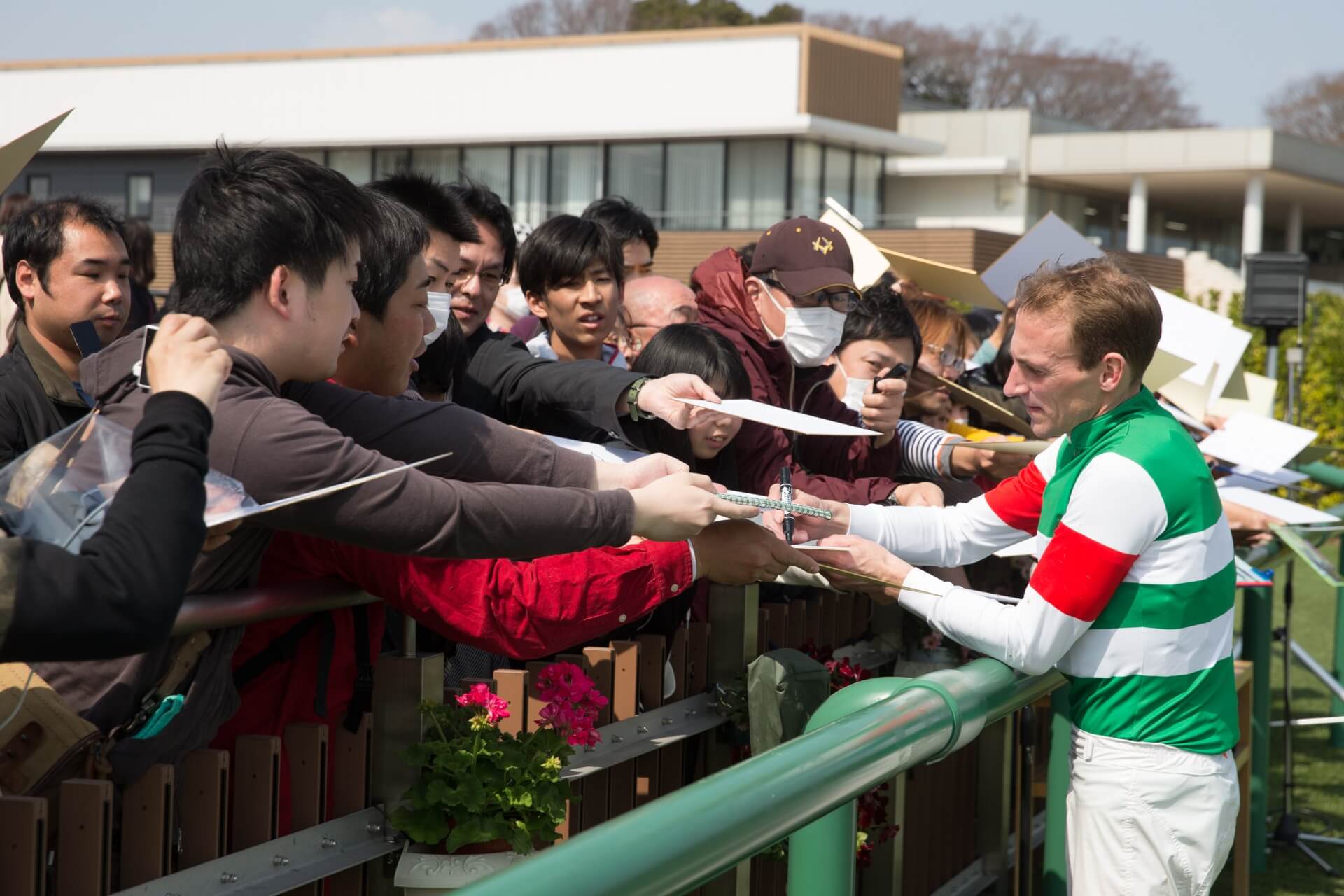 Andrasch Starke signs autographs for Japanese racing fans at Nakayama in 2016