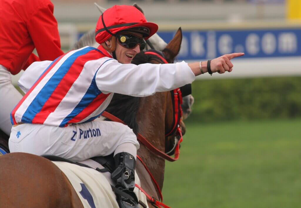 Zac Purton celebrates another Hong Kong win