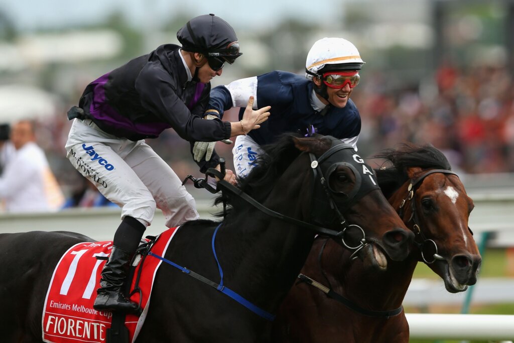 James McDonald congratulations Brett Prebble for winning the 2012 G1 Melbourne Cup