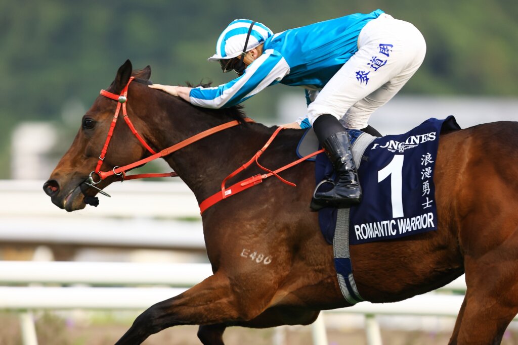 J-Mac pats Romantic Warrior after winning the Hong Kong Cup for the fourth year in a row