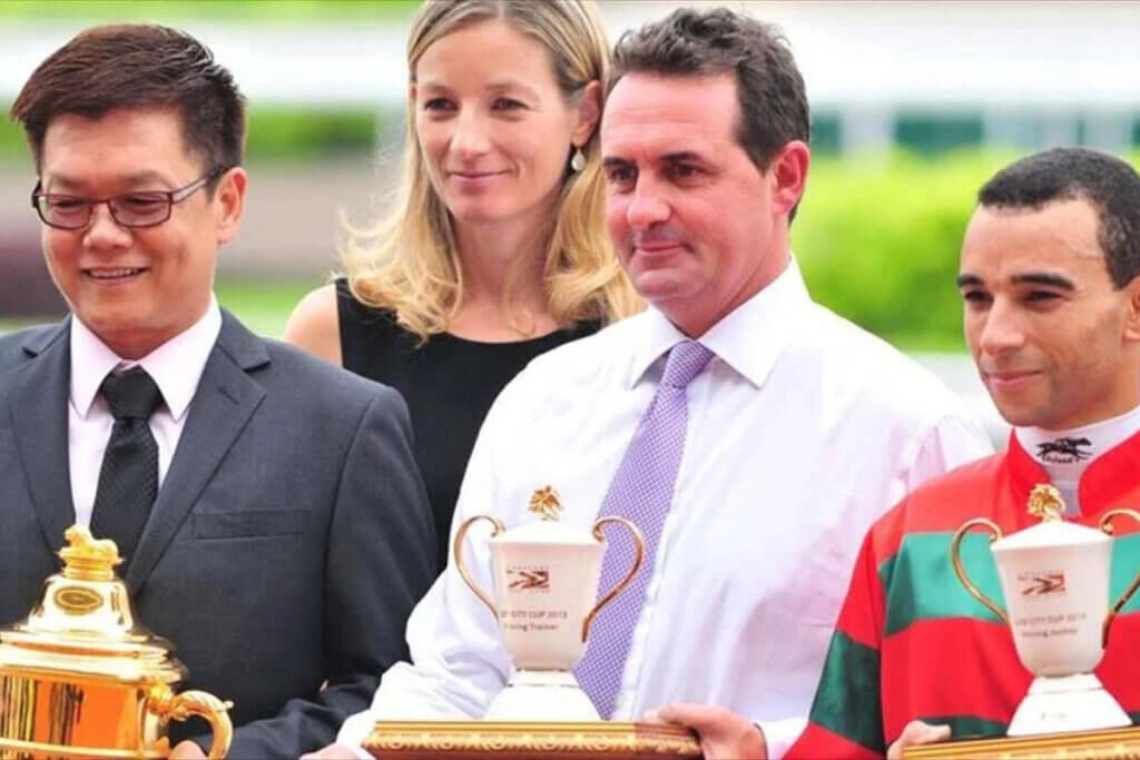 Anne & Michael Freedman pose with Joao Moreira after a win at Kranji, Singapore in 2012