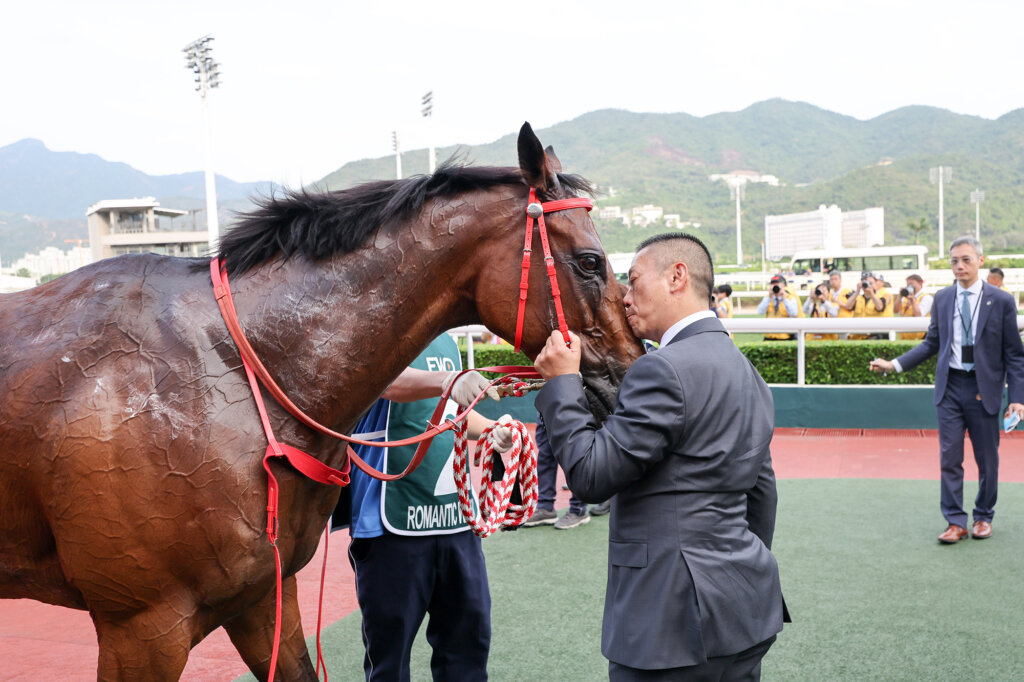Trainer Danny Shum shares a moment with Romantic Warrior
