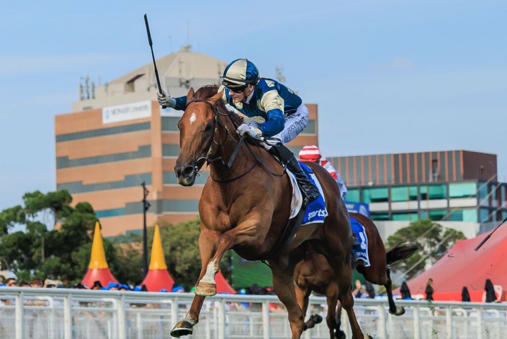 Ethan Brown salutes the Caulfield crowd