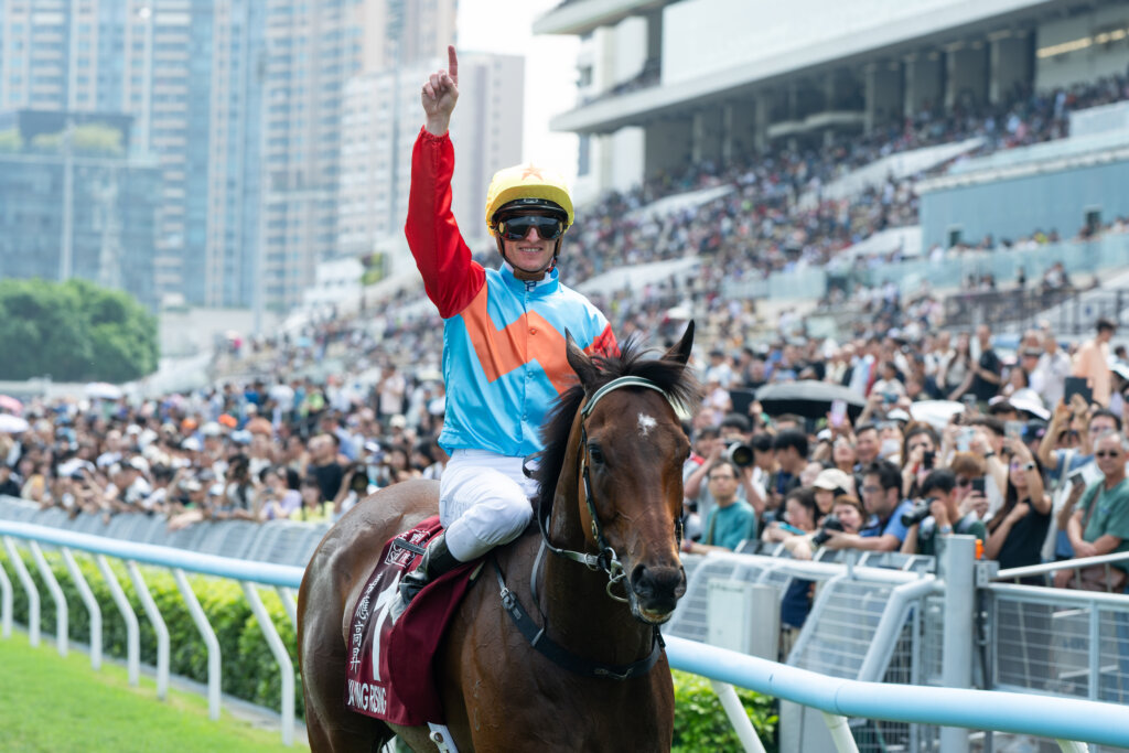 Zac Purton celebrates in front of the Sha Tin crowd