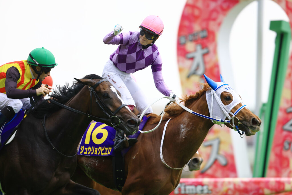 Seina Imamura celebrates her milestone win aboard Juryoku Pierrot in the G1 Yushun Himba