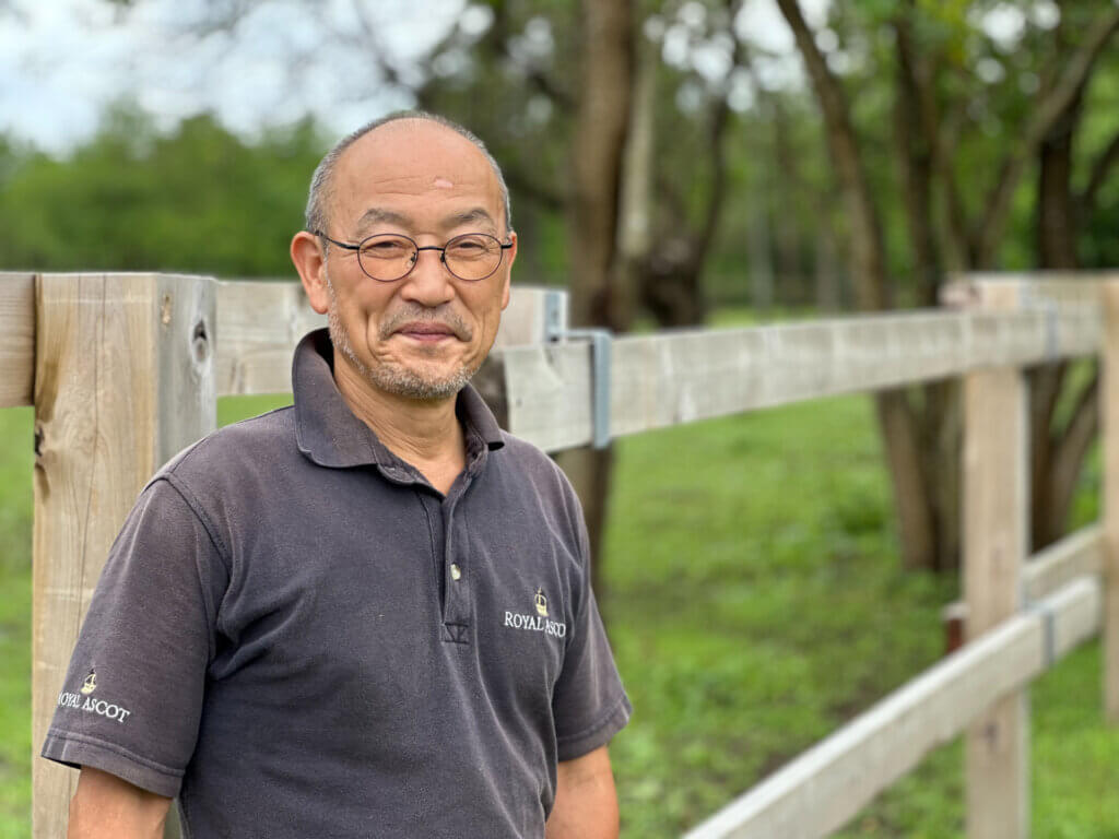 Katsuhiko Sumii as his property in Suzu with his rescued racehorses
