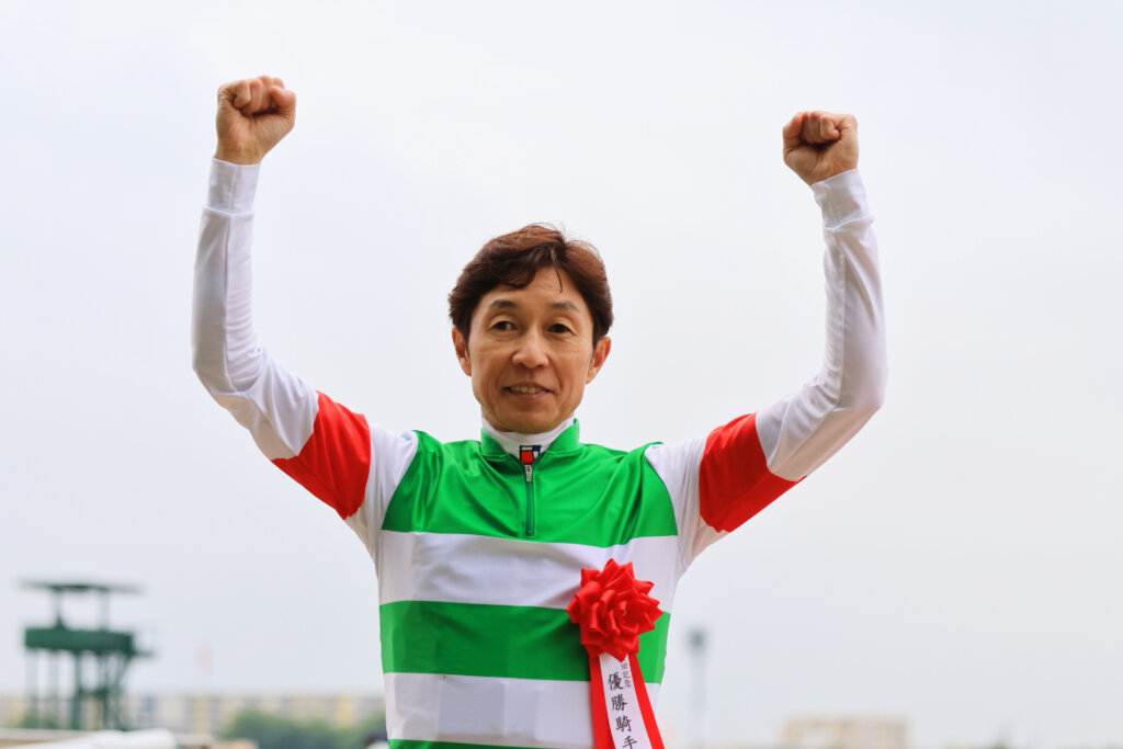 Yutaka Take celebrating his Yasuda Kinen win on Sixpence