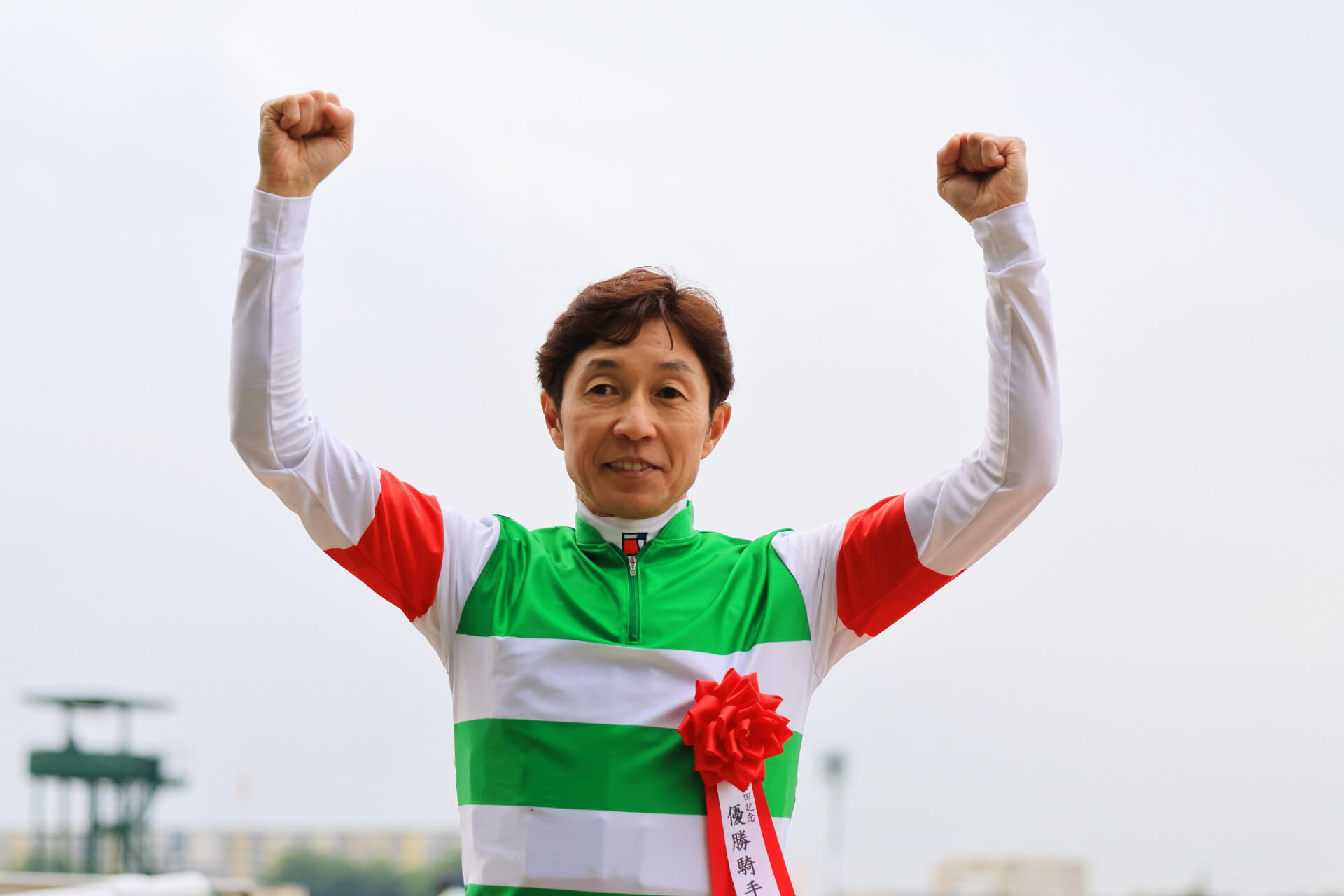 Yutaka Take celebrating his Yasuda Kinen win on Sixpence