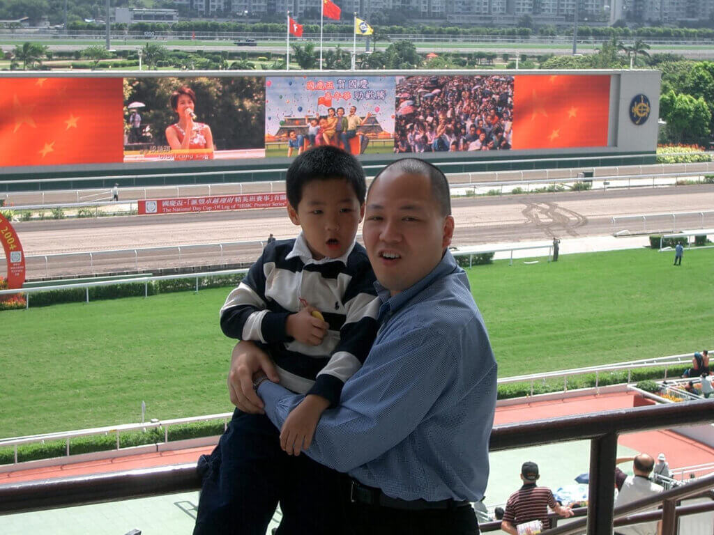A younf Alex So with father Chris at National Day Cup meeting at Sha Tin