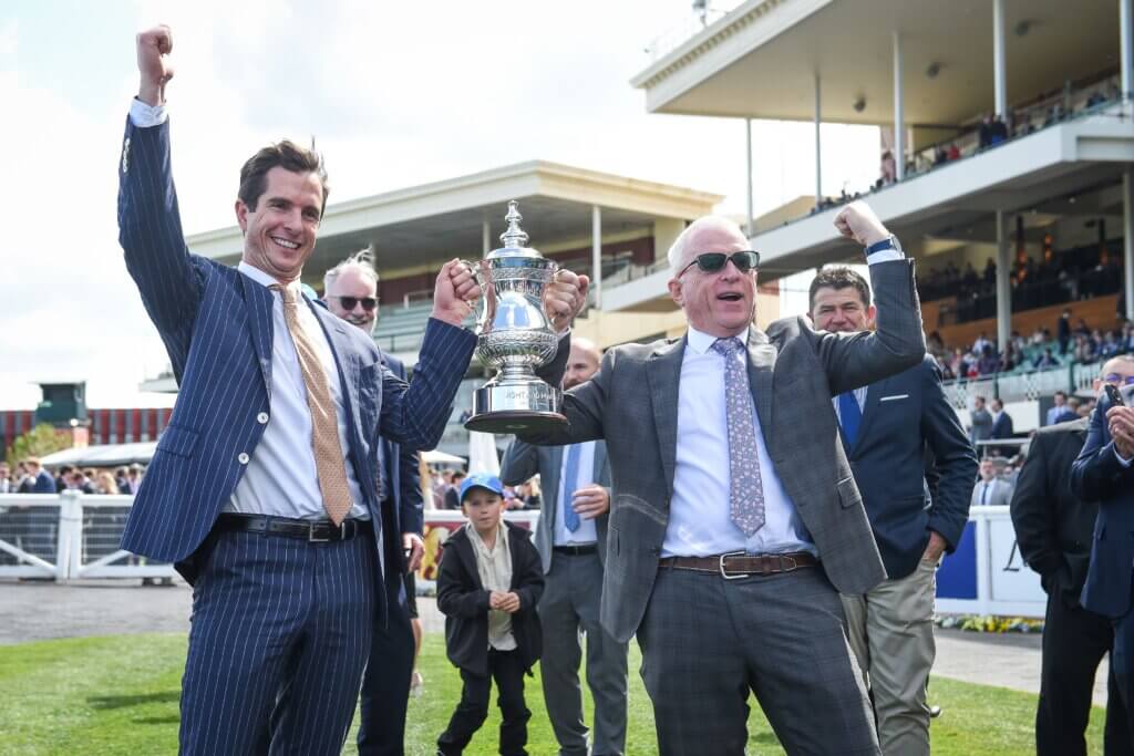 Michael Kent Jnr and Mick Price celebrate the G1 Might And Power Stakes win at Caulfield