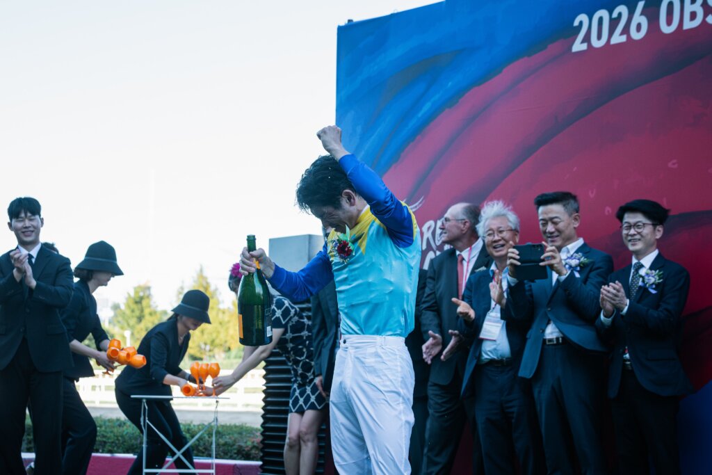 Keita Tosaki with champagne in his eyes after celebrating Korea Sprint win