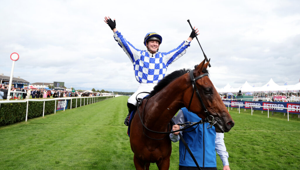 Saffie Osborne celebrating on Highwayman after winning the G1 St Leger at Doncaster
