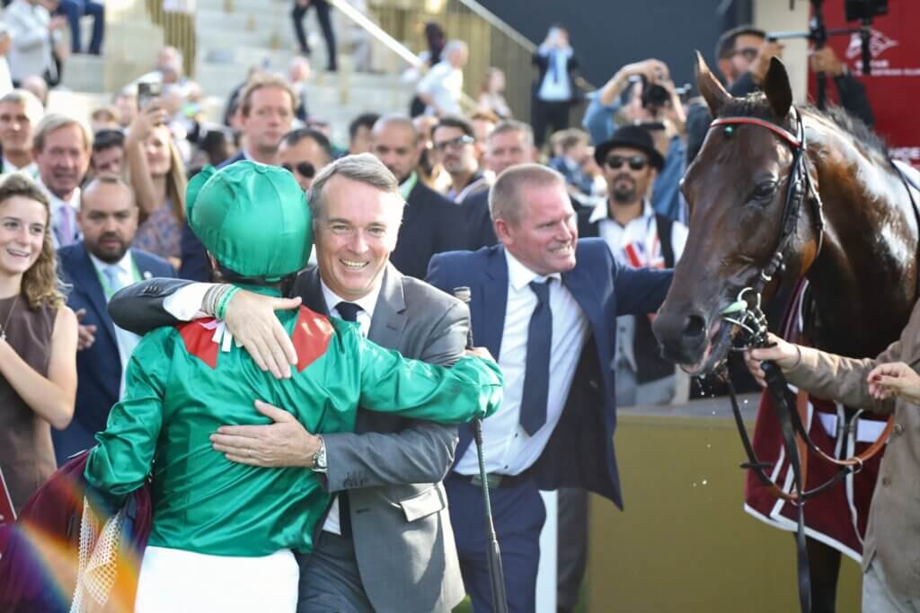 Francis-Henri Graffard embraces Mickael Barzalona after combining to win the Arc again with Daryz