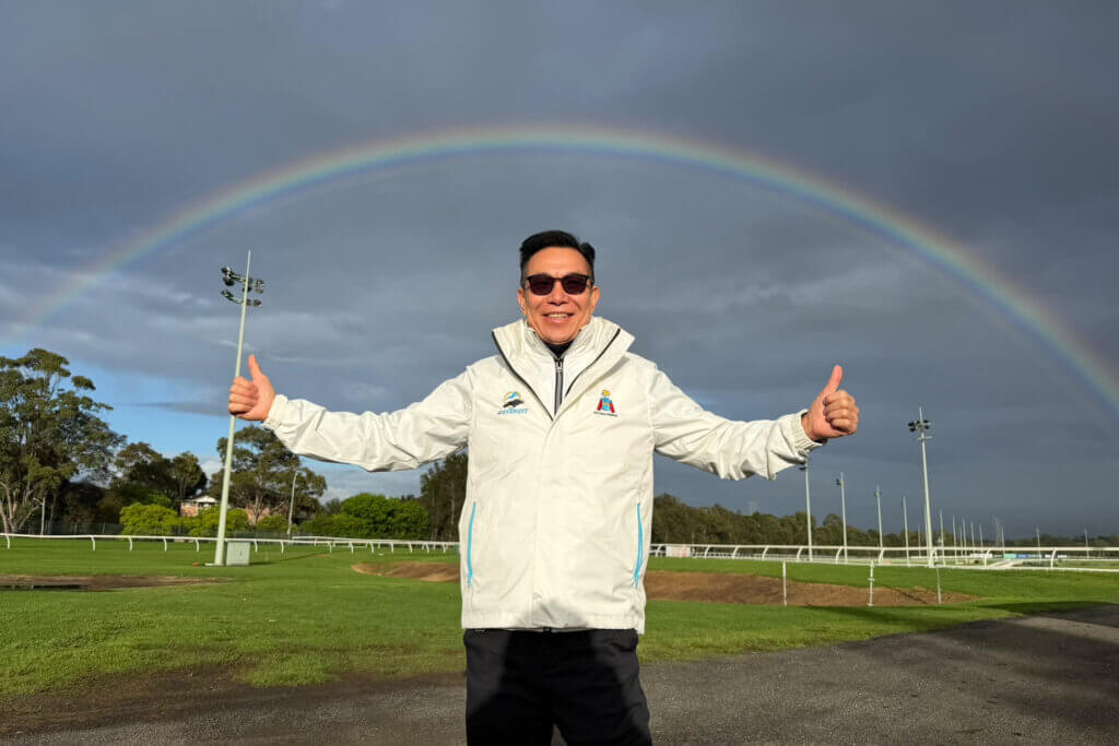Ka Ying Rising's owner Leung Shek-Kong appreciating the rainbows over Canterbury Park